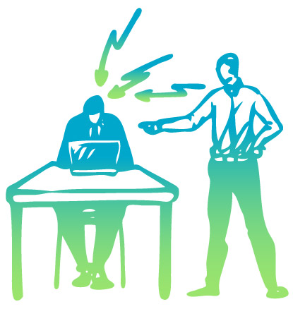 Man standing over a person at a desk yelling at them.